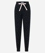 Pantalón de pijama jogger negro con estampado de lunares blancos y lazo rosa en la cintura.