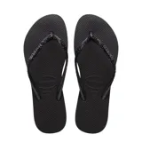 Sandalias Havaianas Slim Glitter II color beige con tiras finas con glitter dorado.