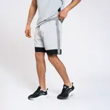 Bermuda de entrenamiento con cierres y diseño en tres colores, confeccionada por Umbro.
