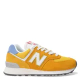 Championes New Balance modelo 574, color amarillo y naranja con detalles en blanco y celeste.
