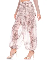 Pantalón tipo babucha con estampado animal print en tonos cálidos, cintura semi elastizada y forro interno.