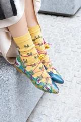 Bailarinas combinadas en python y napa, con cordones y detalle de flores.