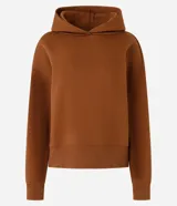 Buzo negro de algodón con forro de polar, cuello con capucha y mangas largas.