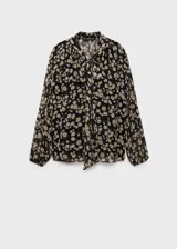 Blusa de gasa negra con estampado de margaritas blancas, cuello en V con lazo, mangas largas y diseño semitransparente.