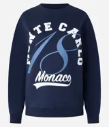 Sweater azul marino de algodón con cuello redondo y mangas largas. Estampa frontal con la frase "Monte Carlo Monaco" en letras blancas y celestes.