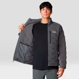 Campera gris con cierre frontal, bolsillos laterales con cierre y logo de la marca en el pecho.