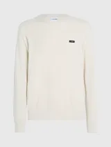 Sweater de punto color crema, de corte recto, con cuello redondo y logo de Calvin Klein en el pecho.