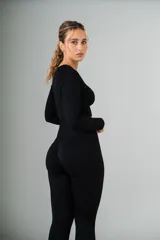 Conjunto deportivo de calza y top de lycra acanalada color verde agua.