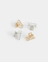 Set de cuatro broches metálicos para el cabello, dos dorados con incrustaciones de nácar y dos plateados.