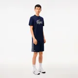 Short de poliéster azul, con ajuste relajado y detalle de cocodrilo bordado en la pierna.