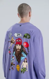 Remera lila de algodón con corte oversize, mangas largas y estampa frontal con la frase "La vida es como una caja de bombones, nunca sabes lo que te va a tocar".