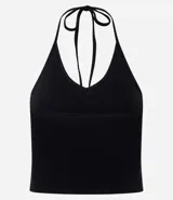 Top cropped de algodón color amarillo pálido, con escote en V pronunciado y tirantes finos que se atan en la nuca (estilo halter). El tejido es acanalado.