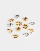 Set de seis pares de aros tipo argolla, con cierre de tuerca. Incluye argollas pequeñas y medianas, en colores dorado y plateado.
