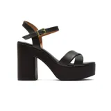 Sandalias negras de plataforma con taco ancho y pulsera al tobillo.