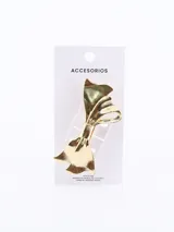 Broche para el pelo dorado con forma de moño.