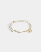 Pulsera dorada con cordón ajustable y dije de trébol con strass.