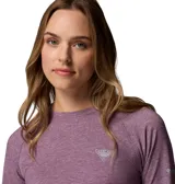 Remera deportiva de manga larga color lila, con logo de la marca en el pecho y en la manga.