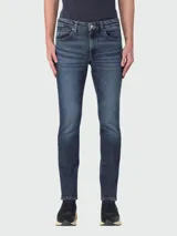 Jeans de denim azul de corte slim fit.