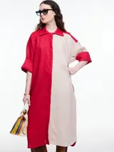 Vestido camisero largo de lino, con manga 3/4 y silueta relajada. Diseño con bloques de color en contraste blanco y negro.