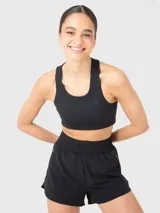Top deportivo negro con espalda de diseño único y almohadillas removibles.