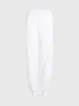 Pantalón de jogging blanco de felpa de algodón con corte relaxed, cintura elástica, puños de canalé, bolsillos laterales y logo del monograma de Calvin Klein bordado en la pierna.