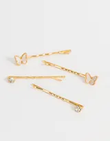 Set de cuatro horquillas doradas para el pelo, dos con apliques de mariposa y dos con apliques de strass.