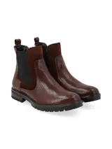 Botín de caña corta color negro, de origen europeo, con combinación de materiales: cuero croco, cuero snake y cuero nobuk. Presenta elásticos laterales al tono y forro de pelo sintético.