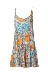 Vestido corto de playa con estampado floral en tonos naranja, celeste y verde sobre fondo blanco.