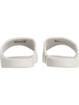 Ojotas Calvin Klein Jeans color blanco, con tira ancha de lona con logo CK en relieve y plantilla con logo de la marca.