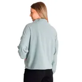 Buzo polar verde oscuro de microfleece, con cierre medio frontal con tirador con logo de Cat, bolsillo tipo canguro con costura divisoria, banda ajustable y parche de silicona con el logo de Caterpillar en el pecho izquierdo.