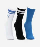 Kit de tres pares de medias deportivas Puma de caña larga. Un par color beige con dos rayas marrones horizontales en la parte superior y logo marrón en el tobillo. Un par color crema liso con logo blanco en el tobillo. Un par color marrón con una raya blanca horizontal en la parte superior y logo blanco en el tobillo.