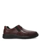 Zapato de vestir para hombre, color negro, estilo mocasín slip-on con elástico lateral para ajuste. Confeccionado en cuero legítimo, presenta costuras decorativas en la puntera y suela gruesa de goma antideslizante.