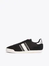 Zapatillas Tommy Jeans de corte bajo, color negro con detalles en blanco y plateado. Capellada de poliéster con paneles de malla y ante.