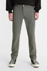Pantalón de pana color gris, corte slim fit, tiro medio.