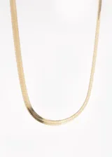 Cadena de acero quirúrgico hipoalergénico con diseño tipo serpiente y extensión adjustable de 5 cm.
