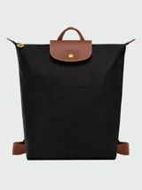 Mochila Longchamp modelo Le Pliage Original M, color crudo con detalles en cuero marrón.