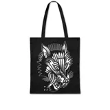 Bolso de tela negro tipo tote bag con asas de hombro. Presenta un estampado en blanco de estilo tatuaje tradicional (old school) de la cabeza de un lobo con la boca abierta y la lengua afuera.