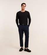 Remera de manga larga color crema, confeccionada en tejido waffle de algodón y poliéster.