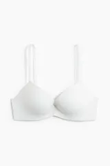 Soutien push-up blanco de microfibra con copas acolchadas que realzan el busto y el escote. Breteles ajustables y cierre de corchetes en la espalda. Con aros.
