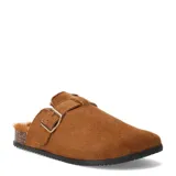 Zuecos de mujer marca Miss Carol, modelo Lucero, en color tostado. Presentan un diseño de punta cerrada con interior de piel sintética y una correa ajustable con hebilla metálica en el empeine. La suela es plana con detalle de corcho y base de goma negra.