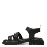 Sandalias blancas con tiras de cuero sintético con tachas plateadas en forma de estrella, hebilla lateral y suela track color negro.