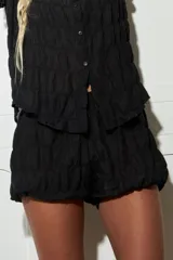 Short celeste de gasa con cintura elastizada y corte balloon.