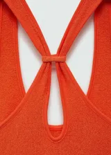 Vestido largo naranja de tejido de punto con tirantes anchos, escote redondo y espalda cruzada.
