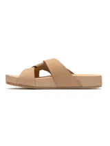 Sandalias bajas color beige con tiras cruzadas y detalle de nudo en el empeine.