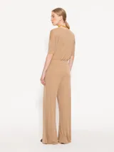 Pantalón palazzo negro de tela de punto con cintura elastizada.