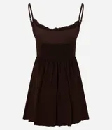 Enterito corto color verde oliva, de breteles finos, escote con volados y detalle de elástico en la espalda. Confeccionado con viscosa certificada.