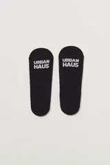 Par de medias negras invisibles.