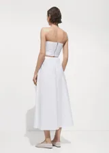 Falda midi evasé de algodón y lyocell color blanco, con tiro medio y cierre trasero invisible.