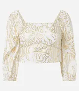 Blusa cropped de mangas 3/4, confeccionada en viscolino con 20% de lino, con escote cuadrado, elásticos en las sisas y puños. Prenda con estampa abstracta de foil.