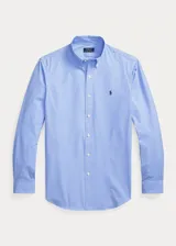 Camisa de hombre Polo Ralph Lauren, corte Custom Fit, confeccionada en popelina de algodón a cuadros celestes y blancos, con cuello abotonado y logo bordado en el pecho.